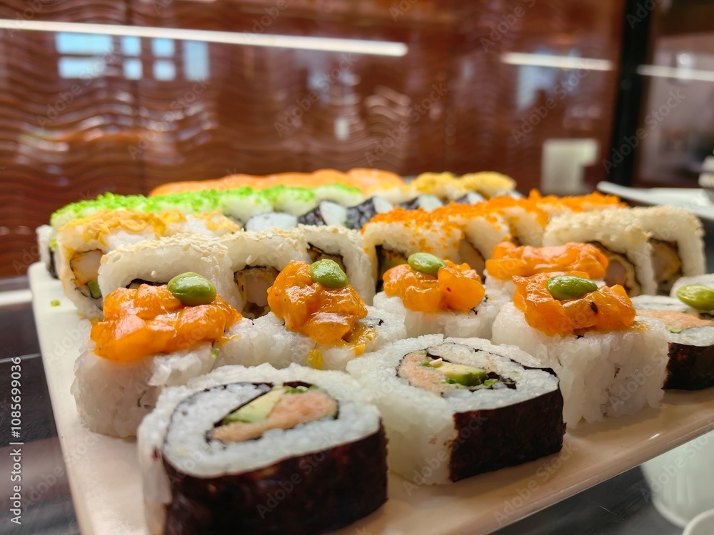 sushi on a plate with various kinds of mixed fish and vegetable condiments.
sushi on a plate with various kinds of mixed fish and vegetable condiments.