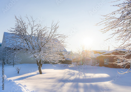 Frosty winter day in a village in Russia. Bright sunny day