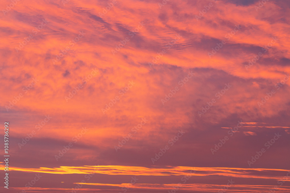 A stunning sunrise sky with vibrant shades of pink, orange, and hints of purple. A stunning sunrise sky with vibrant shades of pink, orange, and hints of purple.