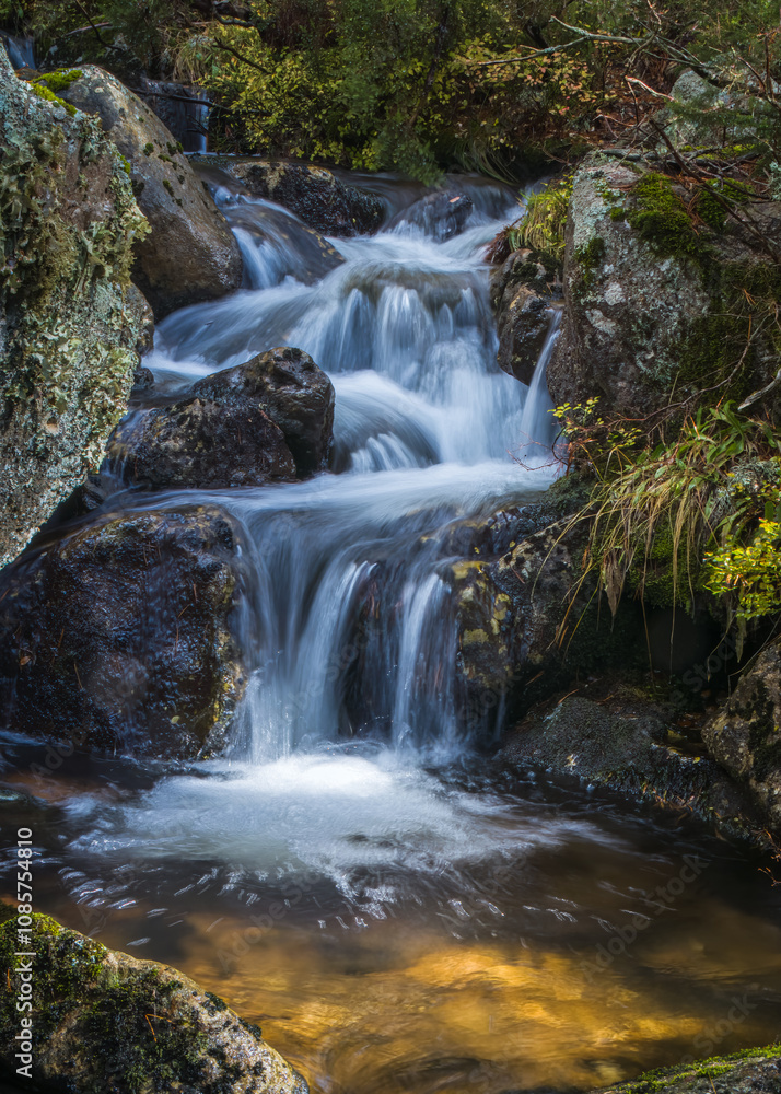 A Tranquil Waterfall Cascades Through the Urbión Mountains A Tranquil Waterfall Cascades Through the Urbión Mountains