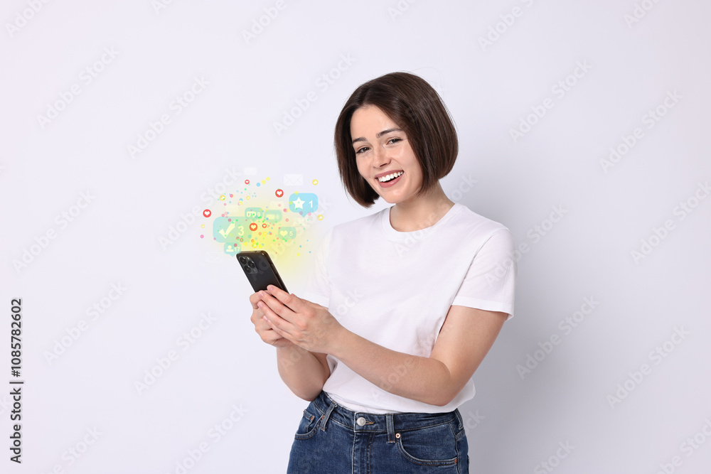 Happy woman using mobile phone on white background. Different notification signs over gadget Happy woman using mobile phone on white background. Different notification signs over gadget