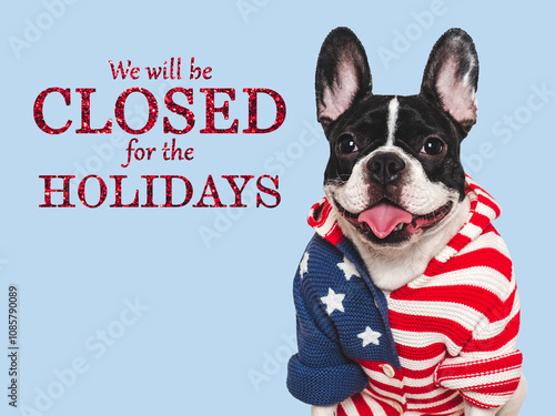 Signboard with the inscription We will be closed for the Holidays. Cute puppy and text for the sign. Closeup, indoors. Studio shot. Pets care concept