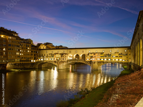 River Arno and Ponte Vecchio at dusk in Florence, Italy