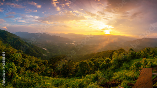 Aerial Panorama view of rain forest mountain during sunrise or sunset time in North of Thailand.