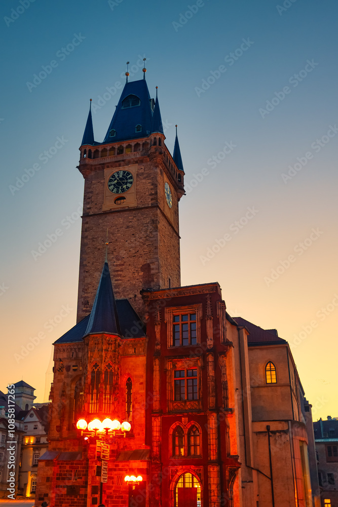 Fototapeta premium Medieval building and tower containing the famous Prague City Astronomical Clock at sunset.