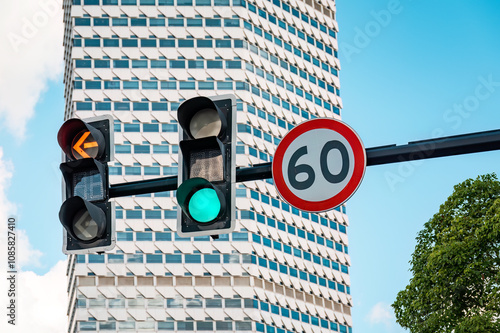 A traffic signal and speed limit sign in a city road in Shanghai, China. photo