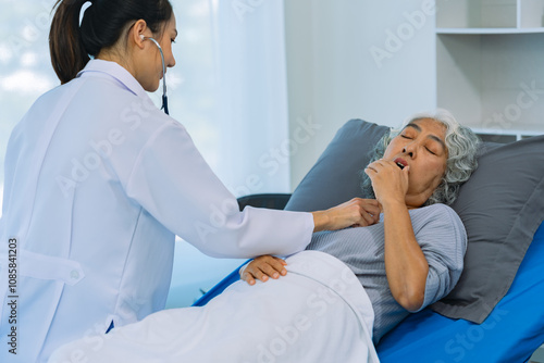 Doctor examining patient with stethoscope during consultation during home visit Doctor using stethoscope to check heart rate of female patient Medical assistance