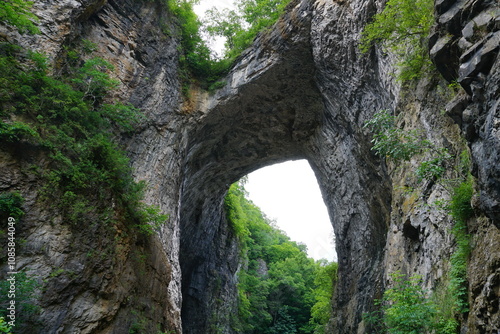 View from below on the landmark rock formation and stone arch of Natural Bridge State Park in the mountains of Virginia, United States of America
