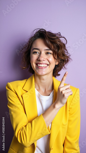 Curious Woman in Yellow Blazer Pointing: Vibrant Portrait for Marketing Campaigns or Business Presentations