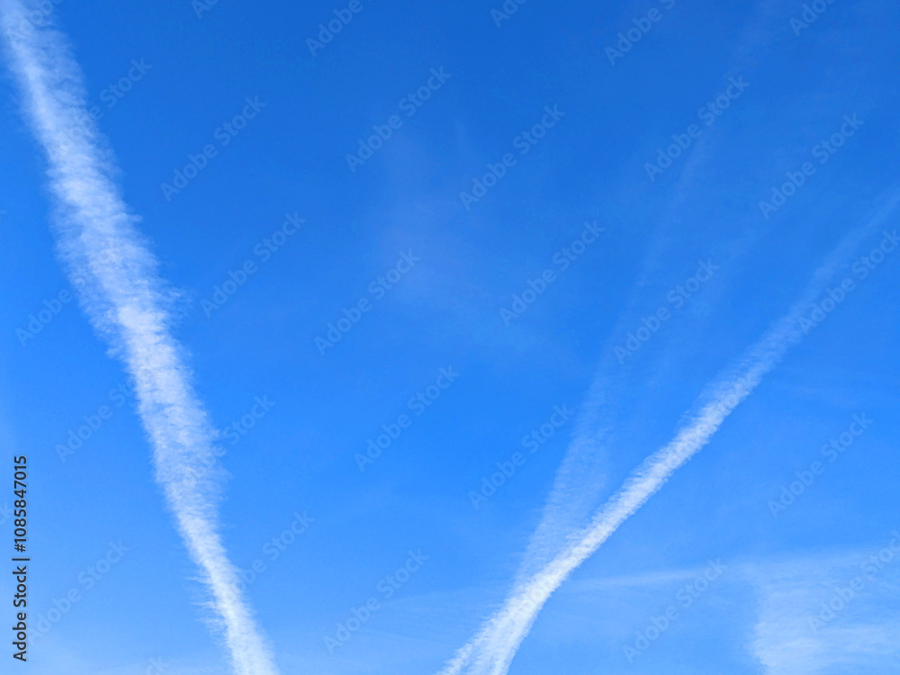 Blue Skys With Aeroplan condensation trails Contails in White Smoke for Background Blue Skys With Aeroplan condensation trails Contails in White Smoke for Background