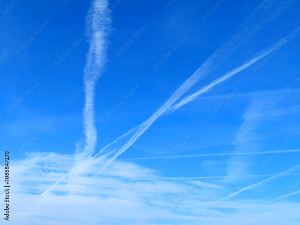 Blue Skys With Aeroplan condensation trails Contails in White Smoke for Background Blue Skys With Aeroplan condensation trails Contails in White Smoke for Background
