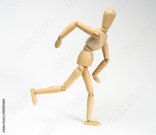 a wooden mannequin while running or on a white background