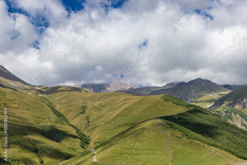 Obraz na płótnie Caucasian mountains near Gergeti village, Stepansminda. Kazbegi mountain behind the clouds. Georgia w salonie