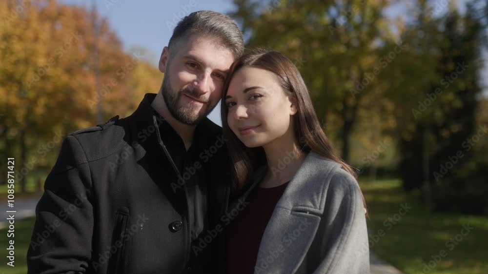 Loving couple in an outdoor autumn setting, capturing joyful moments Loving couple in an outdoor autumn setting, capturing joyful moments