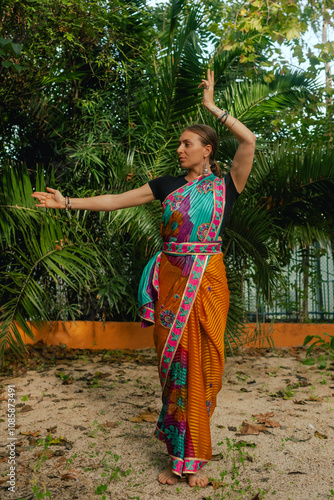 Indian Traditional Beautiful young girl in saree posing outdoors. Happy Diwali greeting photo. Part of a series photo