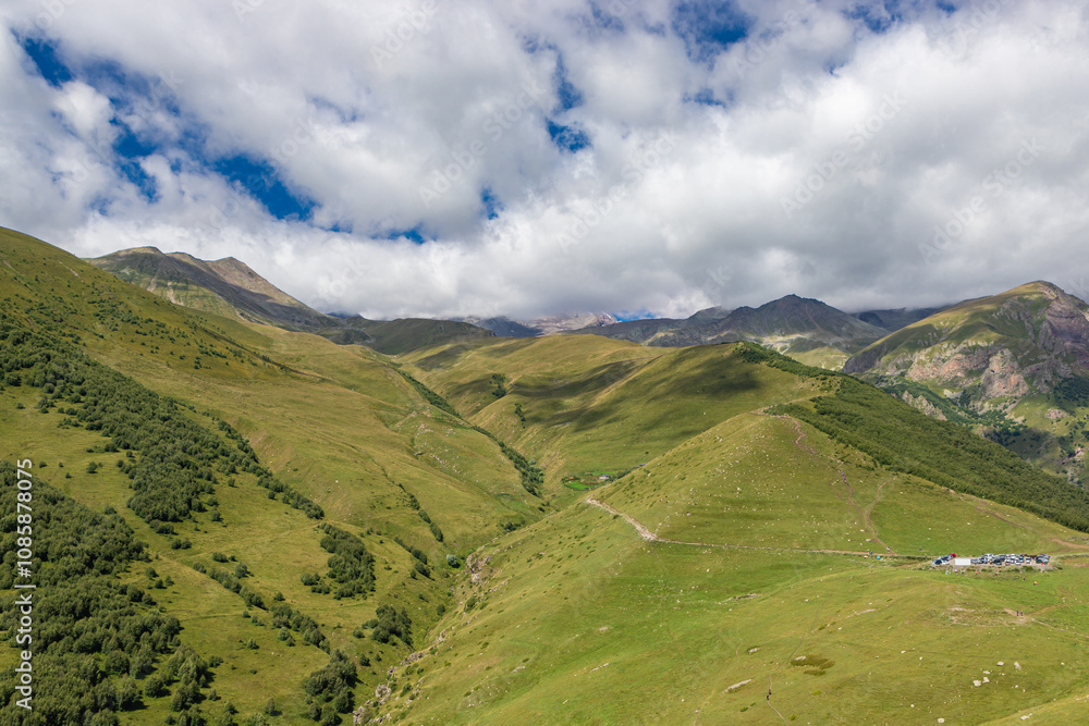 Caucasian mountains near Gergeti village, Stepansminda. Kazbegi mountain behind the clouds. Georgia