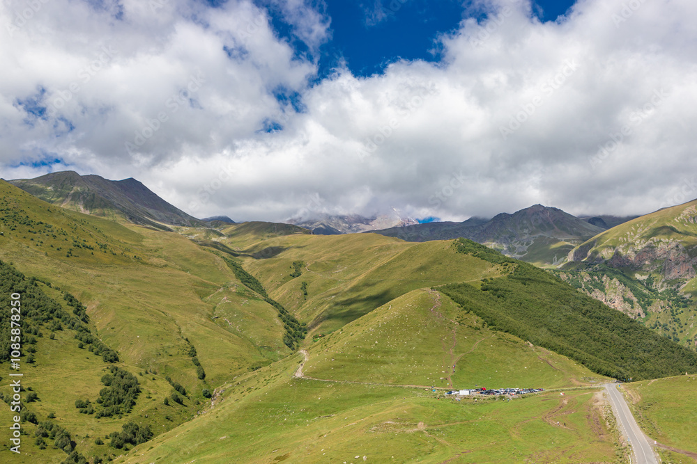 Caucasian mountains near Gergeti village, Stepansminda. Kazbegi mountain behind the clouds. Georgia