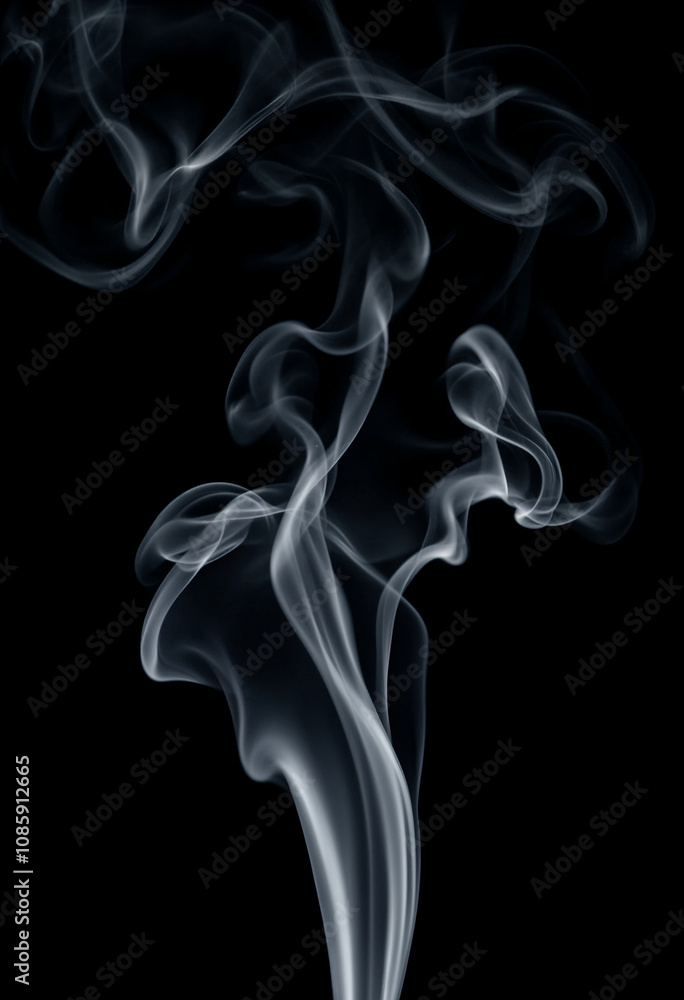 Swirling patterns of smoke captured on a solid black background. Swirling patterns of smoke captured on a solid black background.
