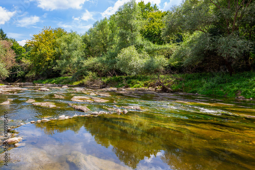 Принти на полотні Sunny August view of the shallow waters of Vidima River in the Bulgarian Fore-Ba