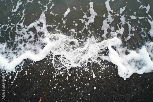 Wallpaper Mural Drone aerial view of the sea or ocean waves splashing on a dark navy blue or gray sand beach with beautiful transparent clear water
 Torontodigital.ca