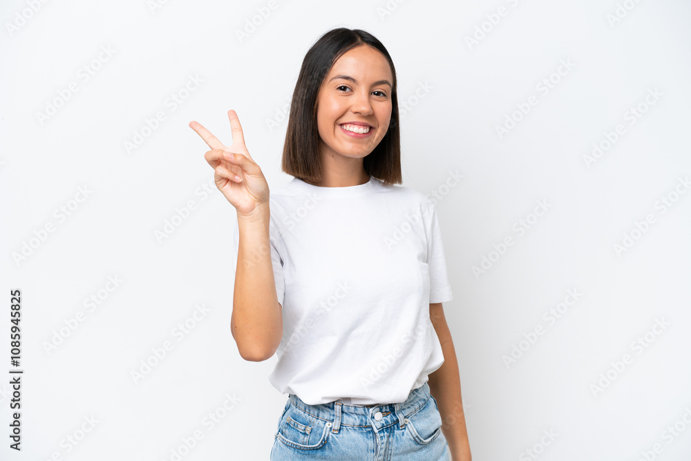 Young caucasian woman isolated on white background smiling and showing victory sign Young caucasian woman isolated on white background smiling and showing victory sign
