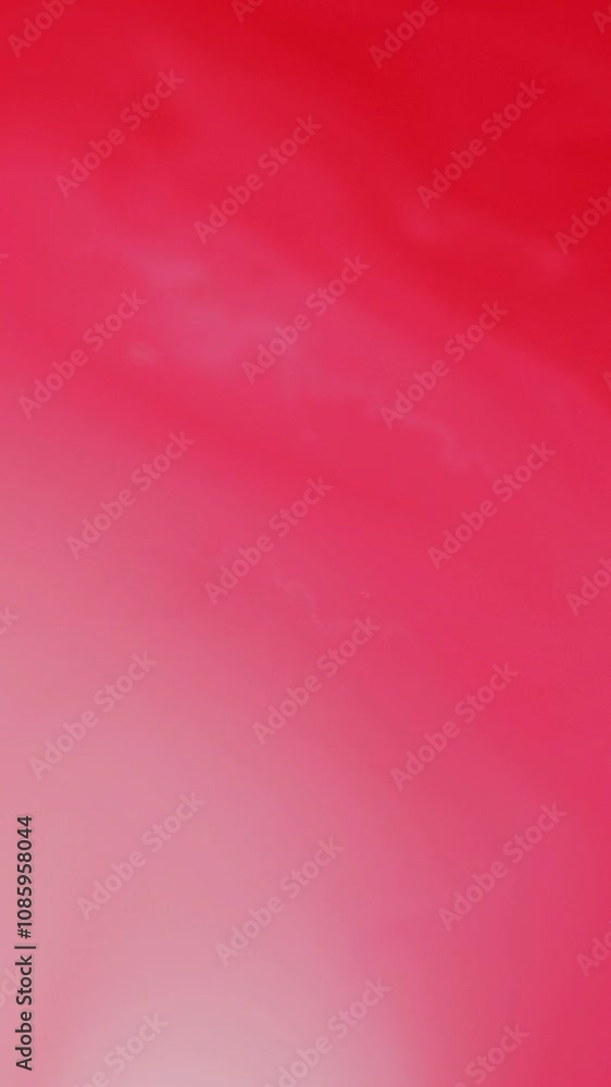 Vertical video. Paint splash. Ink motion. Defocused coral red pink white color mixing emulsion transformation pattern liquid smooth oil texture abstract art background. Vertical video. Paint splash. Ink motion. Defocused coral red pink white color mixing emulsion transformation pattern liquid smooth oil texture abstract art background.