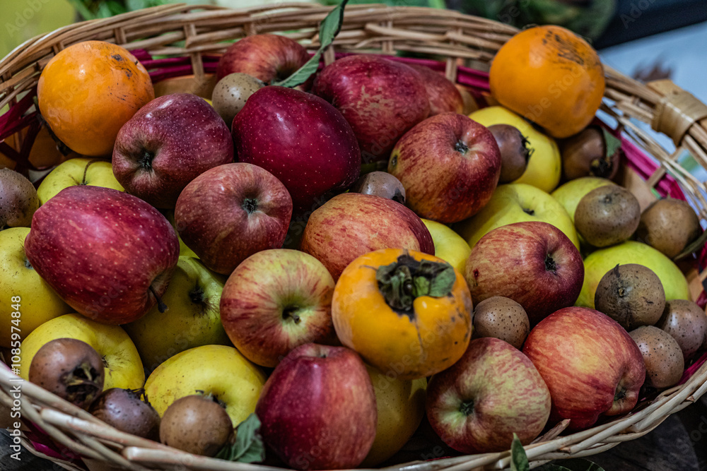 Colorful variety of fresh fruits in a wicker basket, vibrant and ripe Colorful variety of fresh fruits in a wicker basket, vibrant and ripe
