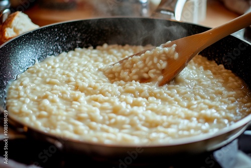 Creamy risotto being carefully stirred in a rustic kitchen on a cozy afternoon. Generative AI photo