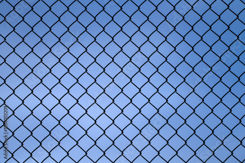 close up on iron chain link fence against sky photo