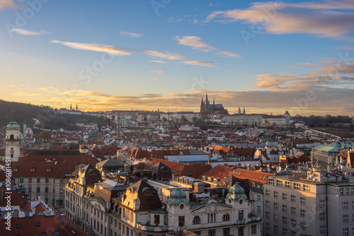 The view from the Old Town Hall over the roofs to Prague Castle in the evening sun photo