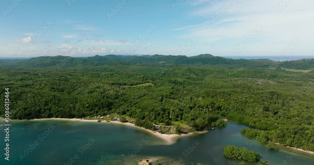 Aerial view of coastline with jungle and rainforest. Borneo. Sabah, Malaysia. Aerial view of coastline with jungle and rainforest. Borneo. Sabah, Malaysia.