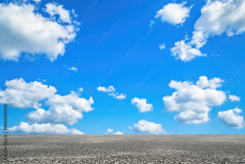 A clear blue sky with puffy white clouds, perfect for a sunny day or a backdrop for your project A clear blue sky with puffy white clouds, perfect for a sunny day or a backdrop for your project
