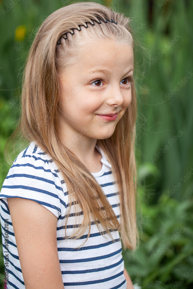 Portrait of beautiful little girl, against background of summer park Portrait of beautiful little girl, against background of summer park