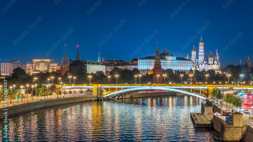 Illuminated Moscow Kremlin and Bolshoy Kamenny Bridge at summer night. View from the Patriarshy pedestrian Bridge Illuminated Moscow Kremlin and Bolshoy Kamenny Bridge at summer night. View from the Patriarshy pedestrian Bridge