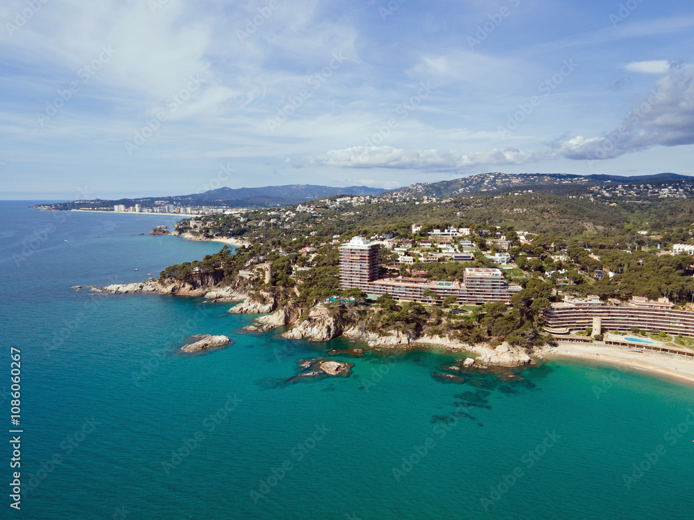 Aerial landscape view of sunny beach in summer and Mediterranean Sea along Costa Brava in Palamos Aerial landscape view of sunny beach in summer and Mediterranean Sea along Costa Brava in Palamos