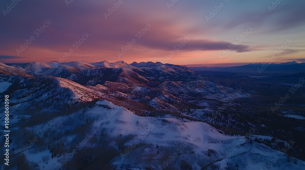 Stunning aerial landscape of snow-draped mountains during sunset, showcasing vibrant colors. Stunning aerial landscape of snow-draped mountains during sunset, showcasing vibrant colors.