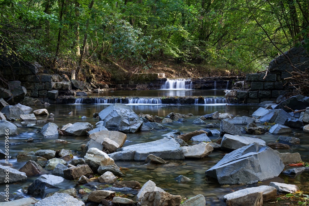 Crumbling weir on a river after a flood. Juhyne. Czechia.
