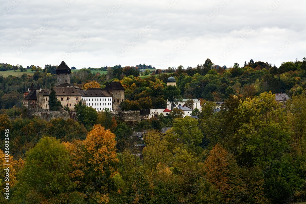 Village with castle ruins in autumn. Sovinec. Czechia. Village with castle ruins in autumn. Sovinec. Czechia.