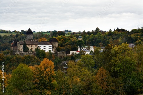 Village with castle ruins in autumn. Sovinec. Czechia.