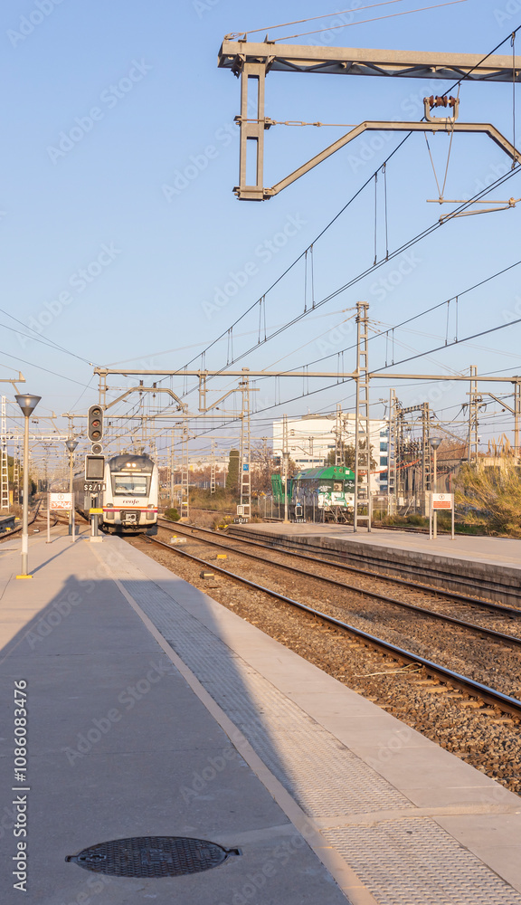 Train is on the tracks at a train station Train is on the tracks at a train station