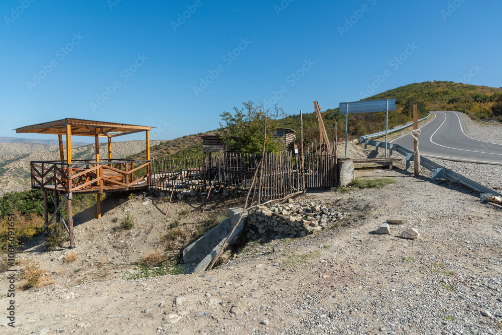 a simple observation deck on the mountainside for viewing mountain views. tourism and travel to the highlands a simple observation deck on the mountainside for viewing mountain views. tourism and travel to the highlands