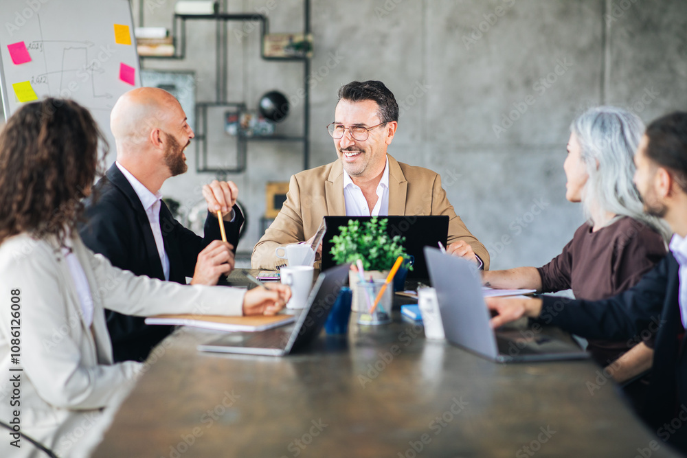 A group of professionals engaged in a lively discussion around a conference table in a contemporary office. Each member contributes ideas with enthusiasm, fostering collaboration. A group of professionals engaged in a lively discussion around a conference table in a contemporary office. Each member contributes ideas with enthusiasm, fostering collaboration.