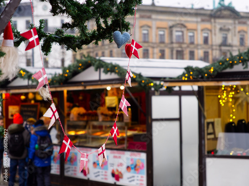 Danish small flags hanging from as ornament in a Christmas market stall in Copenhagen, Denmark 