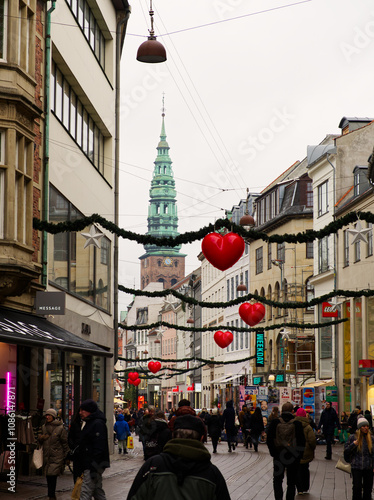 Copenhagen, Denmark - December 7, 2023: Crowded Copenhagen city center streets with pedestrians enjoying Christmas atmosphere with decorations