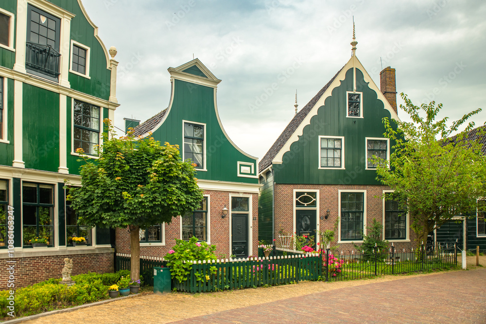 Traditional village with old houses and windmills in Netherlands