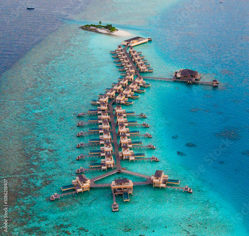 Aerial views of Velavaru Island at sunset in Maldives photo