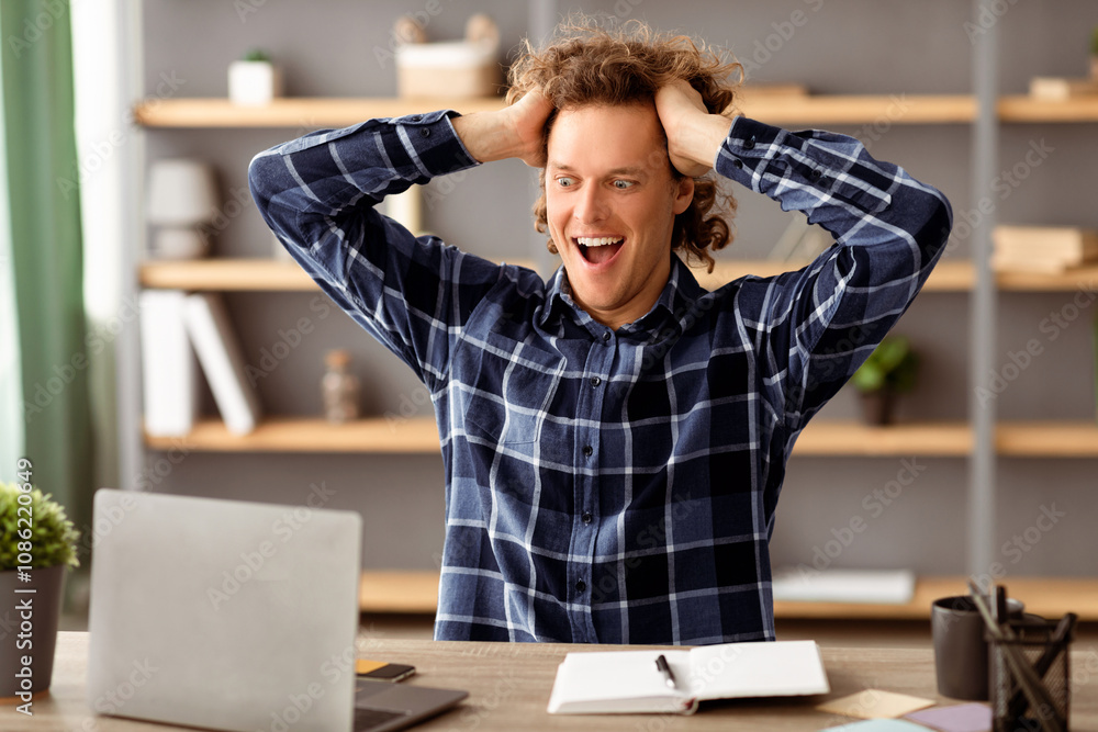 Obraz premium Business Success And Luck. Excited Businessman Looking At Laptop Touching Hair In Excitement Reading Great News Online Sitting At Workplace In Modern Office. Selective Focus