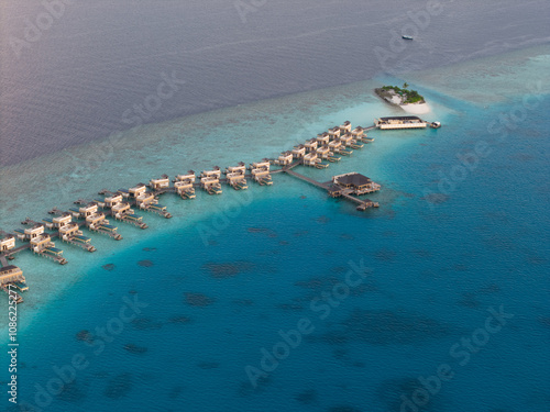 Aerial views of Velavaru Island at sunset in Maldives photo