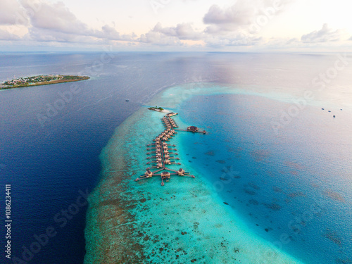 Aerial views of Velavaru Island at sunset in Maldives photo