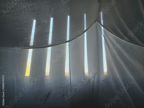 a closeup shot of a white mosquito net